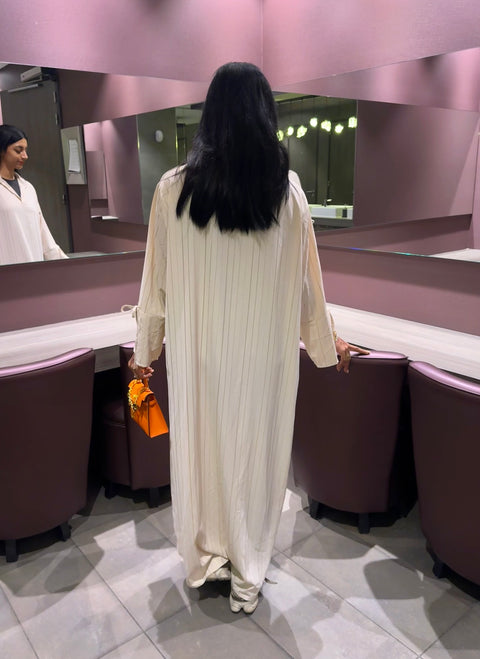 Wijde jurk met gouden strepen