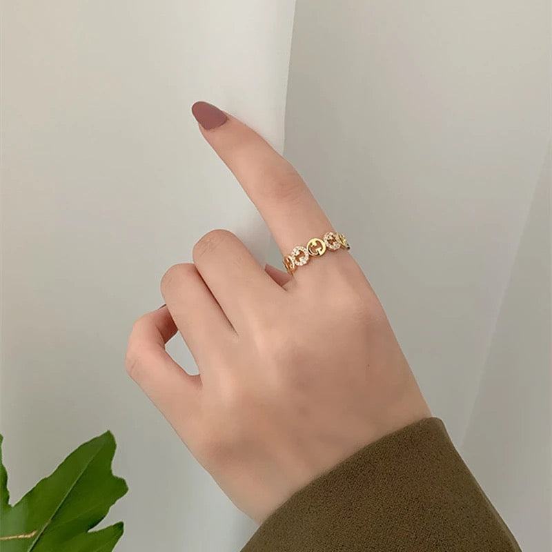 VERSTELBARE RING MET RONDJES GOUD
