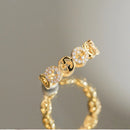 VERSTELBARE RING MET RONDJES GOUD