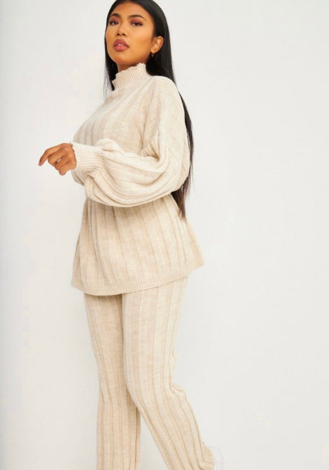 Amiri rekbare broek met oversized trui en een strik band