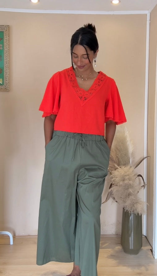 Oranje blouse met figuren