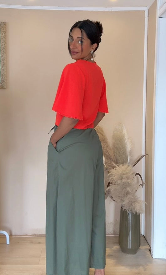 Oranje blouse met figuren