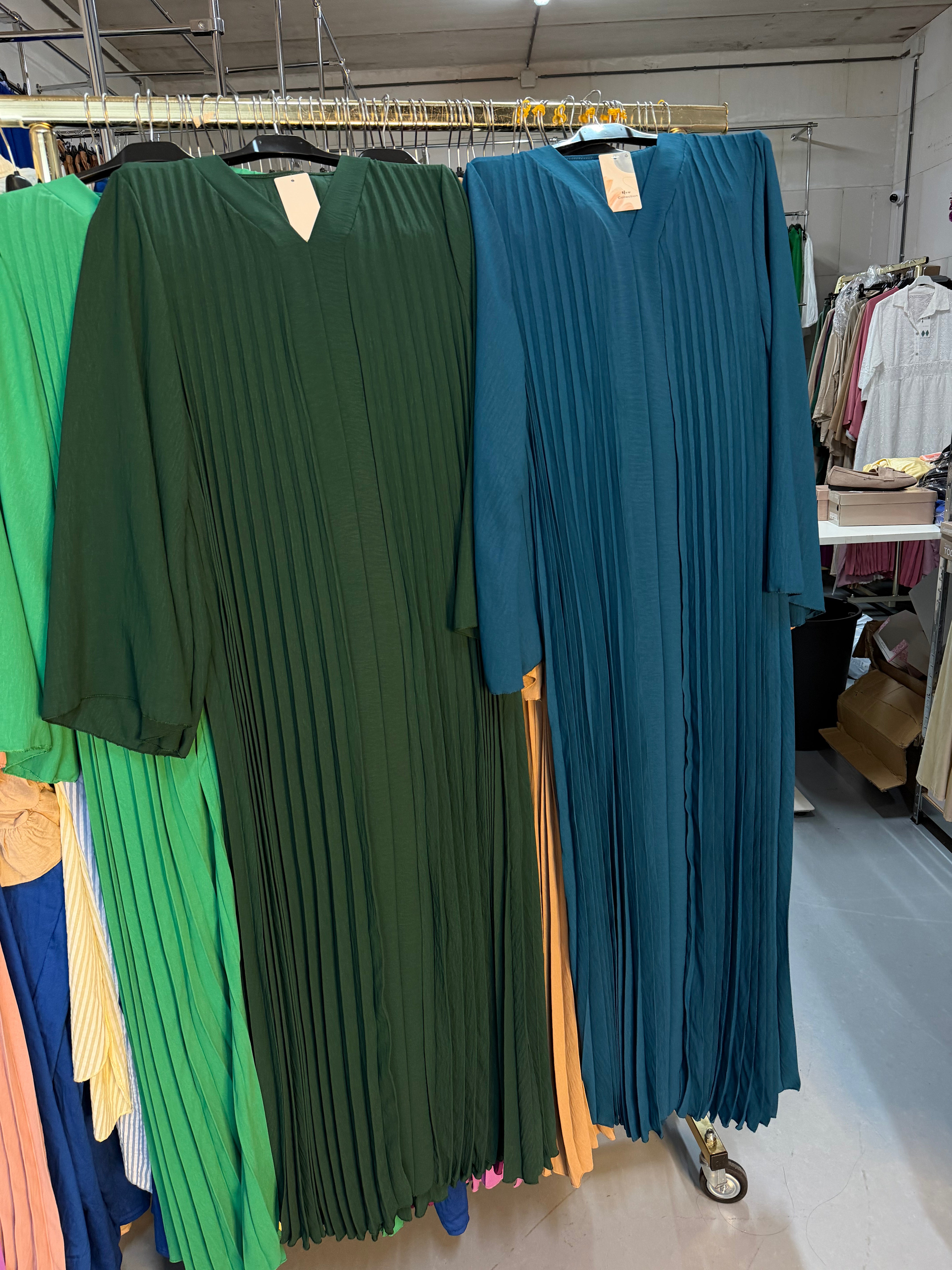 Manar petrol blauw en donker groen flora jurken
